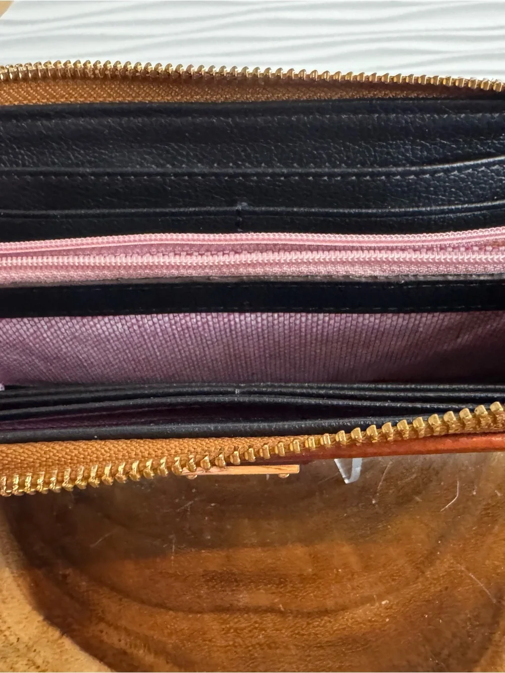 Dooney & Bourke Black Pebbled Leather Zip Wallet with Tan Trim and Logo Plate